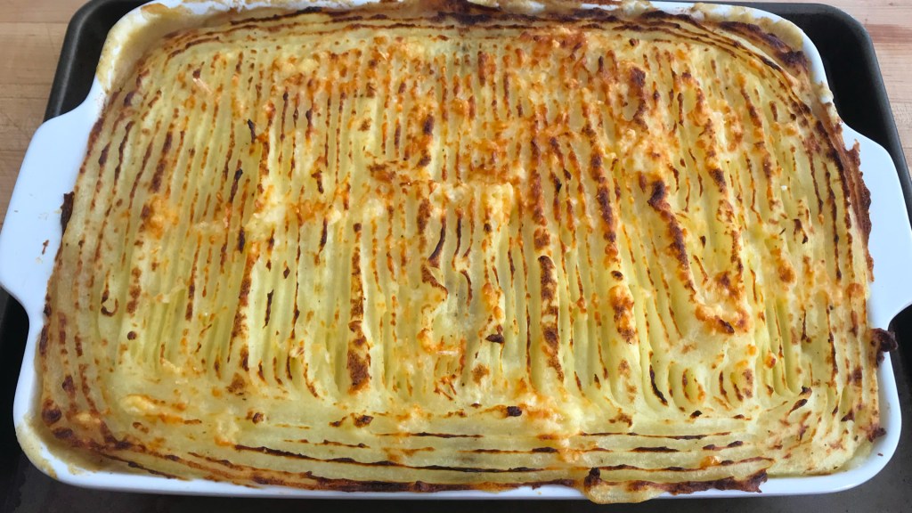 The cooked shepherd's pie, with the ridges nicely browned.